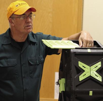 MU EXTENSION FIELD SPECIALIST Todd Higgins leads a composting workshop as part of a series designed to educate residents on growing their own food. SHARON DONAT | Staff