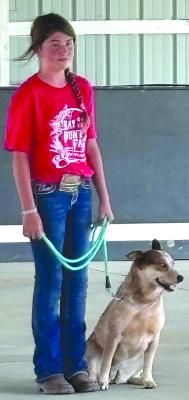 JOSHUA BRUNGARDT | Staff CHEYANNE LORINO shows off her dog.