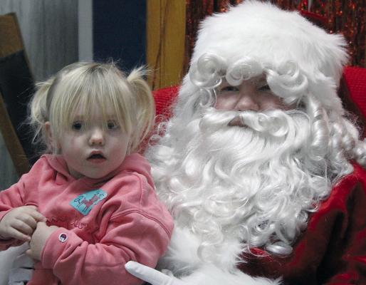 TINSLEY SHANNON takes advantage of her time with Santa by sharing what she wants for Christmas. SHARON DONAT | Staff
