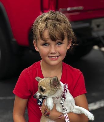 KYNNLEIGH O’DELL and her little dog, Magazine enjoy the fireworks at the American Celebration. JOSHUA BRUNGARDT | Staff