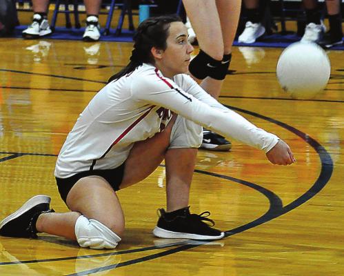 PLAYING LIBERO, senior Savannah Brungardt digs the ball during the first set of Richmond’s bracket-play match with Versailles at the Husker Spikefest on Sept. 11 at Lafayette County of Higginsville. SHAWN RONEY | Staff