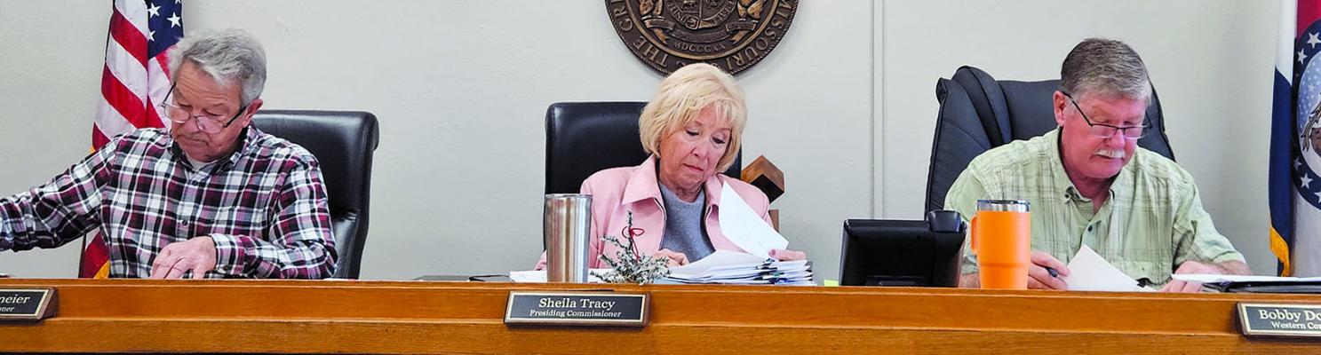 RAY COUNTY COMMISSIONERS review reports and payables during a recent session. MIRANDA JAMISON | Staff