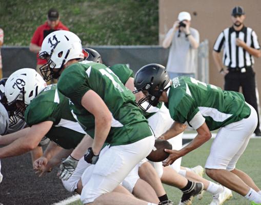 REPRESENTING NHC, J.W. Doyle (No. 79) and Kobe Gibson (No. 11) block for quarterback Zander Stevinson June 24 in all-star action in St. Joseph. SHAWN RONEY | Staff