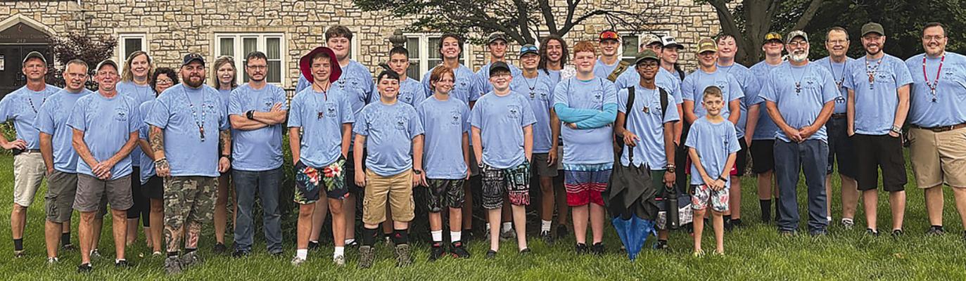 BOY SCOUT TROOP #324 and leaders gather at the United Methodist Church to travel to Boy Scout camp. Submitted