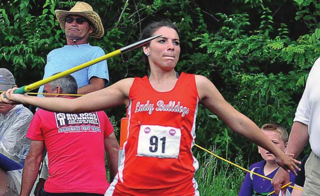 IN AN ALTERNATE WORLD, Hardin-Central senior Izabella Anderson, shown here at the 2019 Class 1 state competition, not only competes in 2020 at state; she wins the javelin and helps the Bulldogs win the meet. SHAWN RONEY | Staff