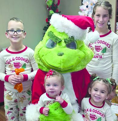THE BARRON FAMILY kicks off the holiday season by visiting the Grinch at the Richmond Area Chamber of Commerce. Members of the Barron family include Lillian (clockwise from top right), Jordan, Elliot and Kayson. JAYNE TAYLOR | Submitted