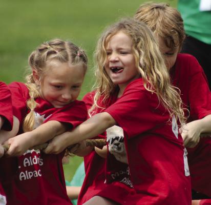 MALLIE FREEMAN (from left), Saoirse Whitman and Gabriel Tolley use their strengths in hopes for a win. SOPHIA BALES | Staff
