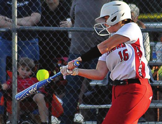 ALEANA McFEE fights off a pitch during the third inning of Richmond’s meeting with Cameron on Monday at Southview Park. McFee and her fellow Spartans rally to win 3-1, extending their winning streak to five games. SHAWN RONEy | Staff