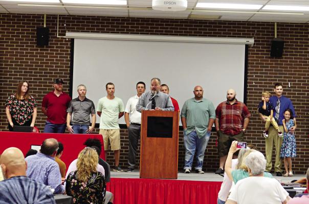 JOHN DANIELS speaks about coaching Richmond’s 2005 Class 1 state champion wrestling team as members of the squad, and a few family members of squad members, fill the stage behind him June 3 near the end of the Richmond High School Athletic Hall of Fame induction ceremony. ELIZABETH BARNT | Staff