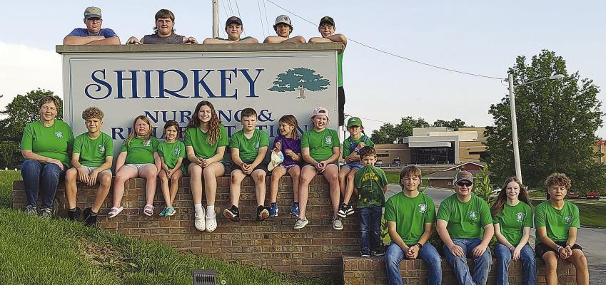Millville 4-H beautify Shirkey Nursing and Rehabilitation Center in Richmond. Below several members plant flowers around a bird bath for seniors to enjoy when outside in the garden. Submitted