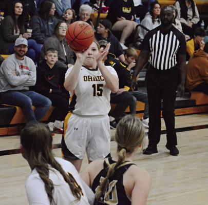 ALL EYES, or at least many eyes, are upon senior Natasha Hicks as she shoots during the first half of Orrick’s Jan. 5 meeting with visiting Norborne in varsity girls basketball. SHAWN RONEY | Staff