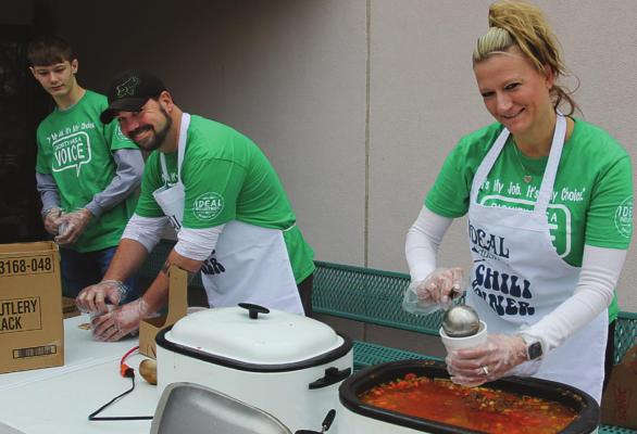 IN ADDITION to ladling out to-go cups of chili and soup at Ideal’s annual fundraiser, the Baker family advocates for maintaining Missouri’s comparative-work system for paying sheltered workshop employees. From left are Gabriel, Gabe and Donna Baker. J.C. VENTIMIGLIA | Staff