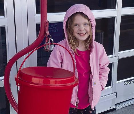 Lillian Opfer was one of a dozen members of the Guys and Gals club ringing the bell for Salvation Army. Submitted