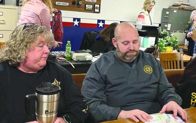 PENNY LEE AND Ray County Sheriff Scott Childers attend the recent Ray County Commission meeting regarding miscommunication among local agencies. SOPHIA BALES | Staff