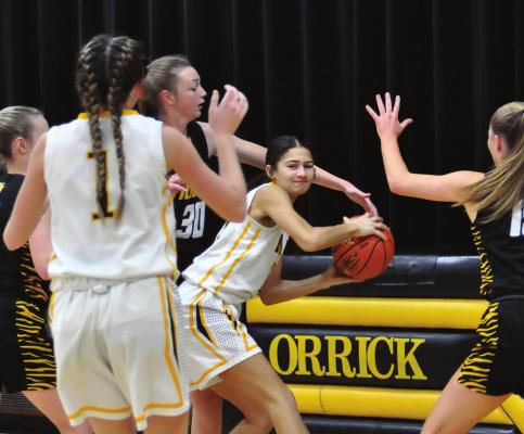 ANELA FLETCHER looks to work the ball out of a crowd under the bucket during the first half of Orrick’s Dec. 4 first-round tournament loss. SHAWN RONEY | Staff