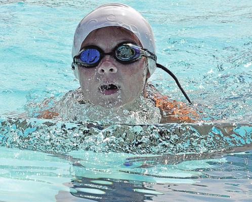 ARIEL LEE helps the Dolphins bring home a meet victory in their season finale July 17 at Southview Pool in Richmond. SHAWN RONEY | Staff