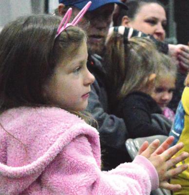 CLAPPING for the puppet show, Josie Riche sports pink bunny ears for the Easter event at the Eagleton Center. TARA ALTIS | Staff