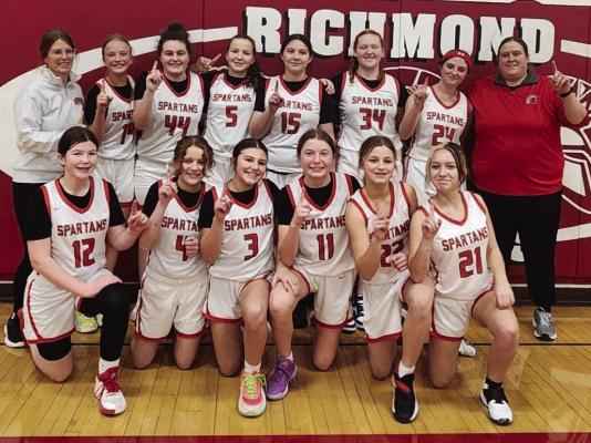 MEMBERS OF THE Richmond Middle School girls basketball team flash the “No. 1” sign after winning the Missouri River Valley Conference-East Division Tournament. Shown are Taylin Jennings (front row, from left), Jadyn Schmidt, Harper Hockemeier, Emmie Mueller, Kayton Arnold and Kaeleigh Damron. Back row: assistant coach Megan Baker, Eva Moyer, Olivia McCroskie, Madison Shroyer, Izzy Hash, Sydney Easton, London Calvert, and head coach Meg Blankenship. STACI MADDUX | Submitted