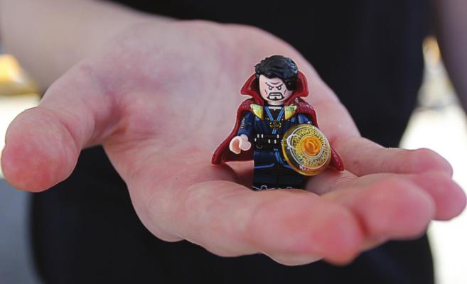 THIS CLOSEUP reveals details in Aidan Leroy’s Lego-compatible version of Dr. Strange, including mystical runes in the orange shield and the cape that climbs up to his ears and has been known to pet his face.