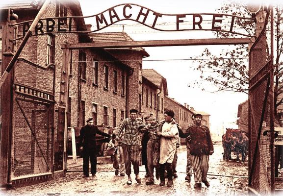 SOVIET SOLDIERS liberate the Nazi death camp at Auschwitz in January 1945, a few months before World War II ends. Over the camp gates are the words, “Arbeit Macht Frei,” meaning “Work Sets You Free.” The meaning is ironic and cruel, because being worked to death is the only way thousands of camp prisoners became free. An exhibition at Union Station covers the story of Auschwitz.