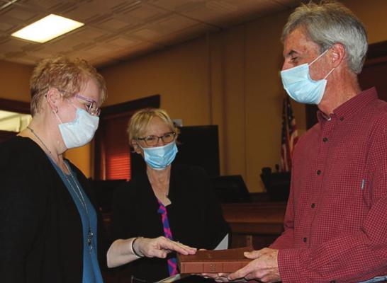 LINDA COLEMAN takes the oath of office as assessor.