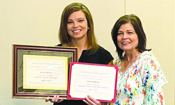 JESSICA BACKS (left) receives recognition as principal Sara Terrill looks on. Submitted