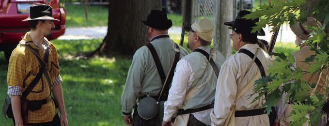 CIVIL WAR reenactors participate in a muster, demonstrating military drills and camp life during a living history event at the Ray County Museum. The event drew spectators interested in learning about the daily life of soldiers during the 1860s. SHARON DONAT | Staff