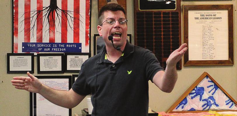 AT THE RAY COUNTY Veterans Memorial Community Building, auctioneer Steve Ritter takes bids for pens, inkwells, coins, watches and other collectibles. J.C. VENTIMIGLIA | Staff