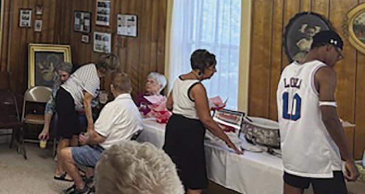ATTENDEES ENJOY nachos and networking at the Richmond Area Chamber of Commerce After Hours, which brought an ’80s Richmond Mall theme to the Ray County Museum. MICAH DILLMAN | Staff
