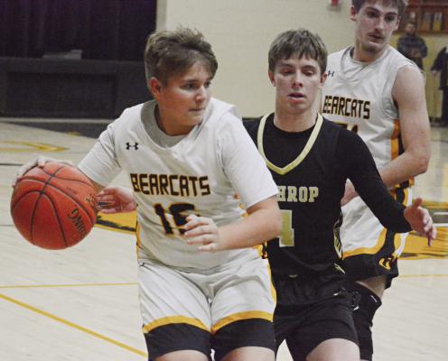 FRESHMAN LANDON SMITH (left) gets some game experience during Orrick’s non-conference clash with Lathrop in varsity boys basketball. SHAWN RONEY | Staff