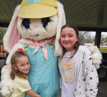 EVERLEE CLONINGER (left) and Oaklee Cloninger visit the Easter Bunny before racing for eggs at Maurice Roberts Park. Submitted