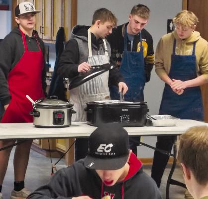 ORRICK FFA STUDENTS prepare food for the annual community breakfast, an event open to the public. FFA teacher Don Honeycutt said the event reflects the program’s purpose of service, adding, “This is our way of giving back to the community.” SHARON DONAT | Staff