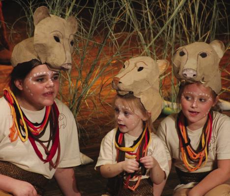 LIONESSES ISABELLA HENDELEY (from left), Gray McBee and Addison Garland sit on stage during the first scenes of the Farris Youth Theatre Company’s musical performance. Read story on page 5, see more photos on page 16. SOPHIA BALES | Staff