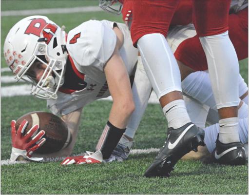 SOPHOMORE NOLAN QUICK stretches out when he’s tackled after a short gain on a first-half pass play during Richmond’s Sept. 15 varsity football clash with Van Horn, an Independence-based school. Van Horn, playing at home, goes on to defeat the Spartans 29-12. SHAWN RONEY | Staff