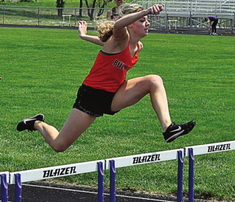 GRACIE GIBSON of Hardin-Central sails through the air late in the girls 300-meter low hurdles May 8 during Class 1 District 7 competition. Gibson finishes second to qualify for sectionals. SHAWN RONEY | Staff