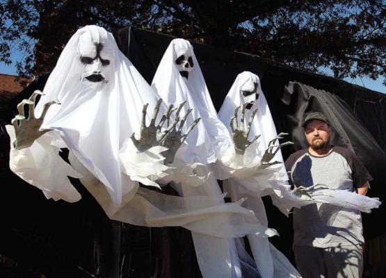 THREE INTENSE GHOSTS and Kenny Thompson stand ready on Halloween to greet trick-or-treaters. J.C. VENTIMIGLIA | Staff