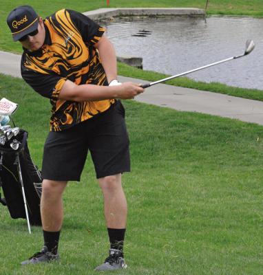 SENIOR TRENT WINDSOR follows through on a shot during Orrick’s boys golf dual with Faith Christian Academy. SHAWN RONEY | Staff