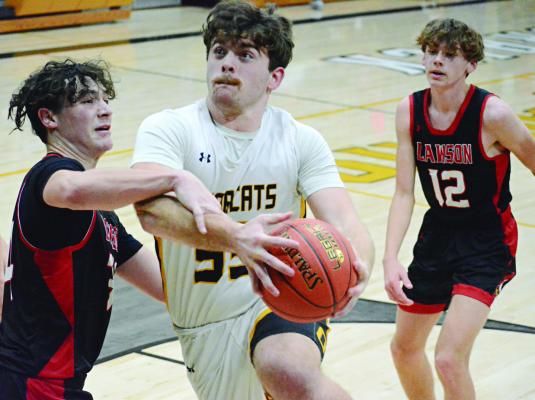 TUCKER GREER attempts a contested first-half layup during the Bearcats’ varsity boys basketball meeting Monday night with visiting Lawson, whose coaching staff includes former Orrick teacher and coach Mitch Comstock. SHAWN RONEY | Staff
