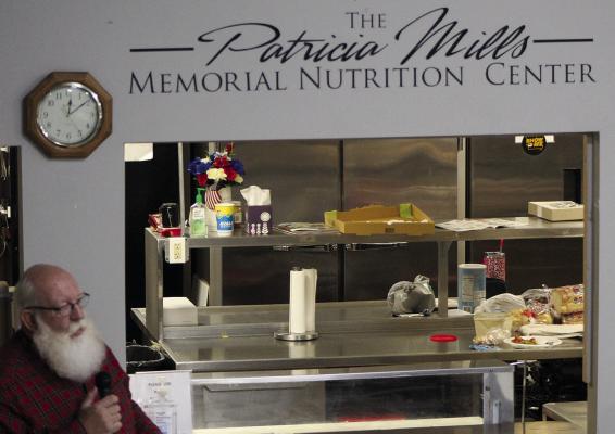 BRYAN COUCH PRESENTS the new Patricia Mills Memorial Nutrition Center during the dedication ceremony. SHARON DONAT | Staff