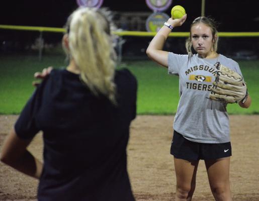 JUNIOR KYNLEE LOPEZ throws while participating in a short toss drill as she and her Richmond teammates hold their Midnight Madness practice Aug. 7 at Southview Park to get their latest varsity softball campaign underway. SHAWN RONEY | Staff