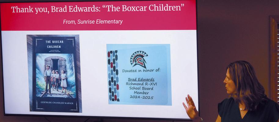 SUNRISE ELEMENTARY Principal Sara Terrill thanks the school board members with a book donated in each of their names to the Sunrise library. SHARON DONAT | Staff