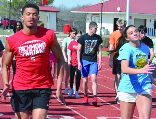 BRICE DOME (left), shown warming up at practice with Emma Hash, is among three returning state qualifiers for Richmond in track and field. Dome placed seventh in the triple jump at the 2025 Class 3 state meet. SHAWN RONEY | Staff