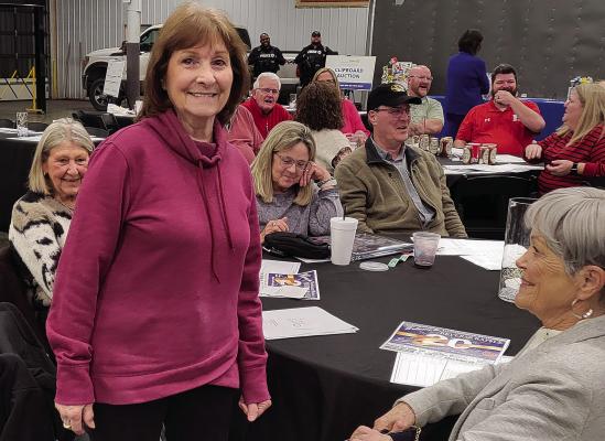 NANCY GILBERT has the winning number at the annual Richmond Rotary Reverse Raffle, taking home the grand prize of $10,000. SHARON DONAT | Staff