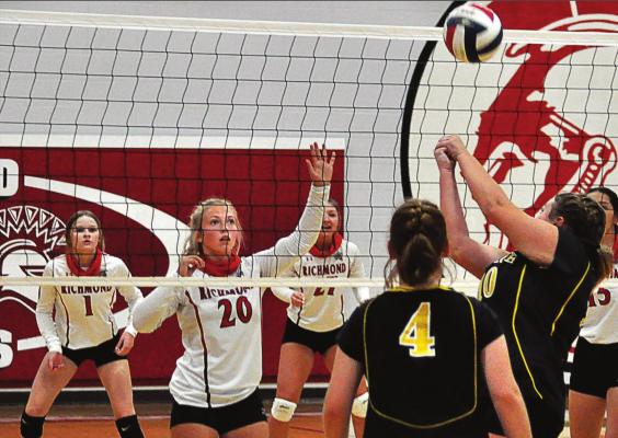 SHAWN RONEY | Staff LANEY MOYER, No. 20, is ready to go up to attempt a block for the Spartans, if necessary, as the Bearcats attempt to get the ball over the net during a Sept. 10 meeting at Richmond.