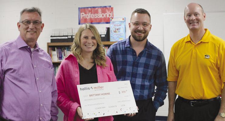 JOHN BROWN (from left), Brittany Horine, Cam Hinton and Dr. Bryan Copple discuss the $250 grant Horine won with Hollis and Miller Architects. SOPHIA BALES | Staff