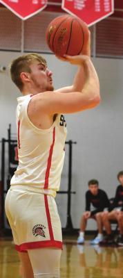 SPENCER WOLF attempts a first-half jumper Tuesday night.