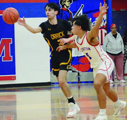 JACOB SCHARFF (left) makes a one-handed pass in Orrick’s backcourt while guarded by Zach Melvin.