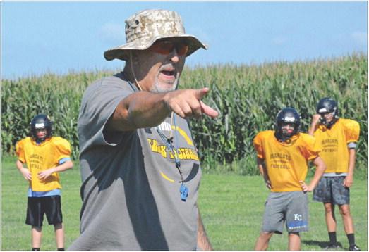 ORRICK VARSITY 8-MAN football coach Kirk Thacker, shown teaching his Bearcats as he points during an August practice, looks to get his ballclub in the win column Friday, when the Bearcats visit Concordia. SHAWN RONEY | Staff