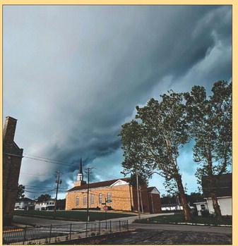 DARK CLOUDS LOOM over Ray County as stormy skies signal the approach of peak tornado season. Pictured above is the tense calm just moments before tornado sirens began to sound, following confirmed tornado sightings in the Kansas City area. MIRANDA JAMISON | Staff