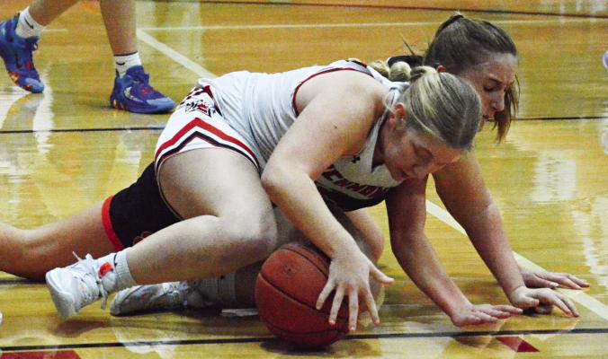 SENIOR HAYLEE WEBER keeps a firm hand on the basketball Tuesday night during Richmond’s 46-33 victory over Oak Grove in the Richmond Winter Classic. SHAWN RONEY | Staff